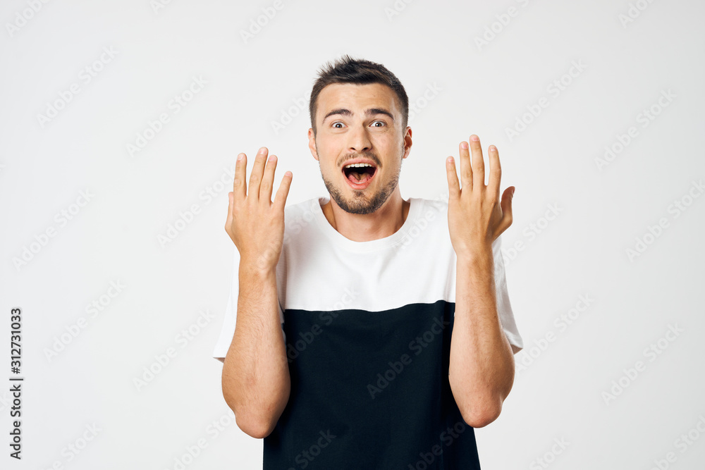 portrait of young man with his hands up portrait of young man with his hands up