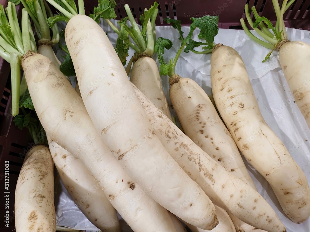 Top view of fresh radishes as a background for sale in the market at Thailand, for cooking, healthy food concept Top view of fresh radishes as a background for sale in the market at Thailand, for cooking, healthy food concept