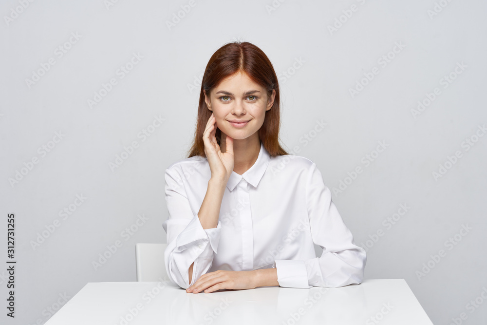portrait of a businesswoman sitting at her desk portrait of a businesswoman sitting at her desk