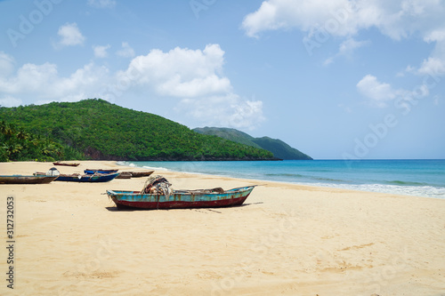 Old fisherman boats on the beach at the day,Samana beach,Dominican Republic.