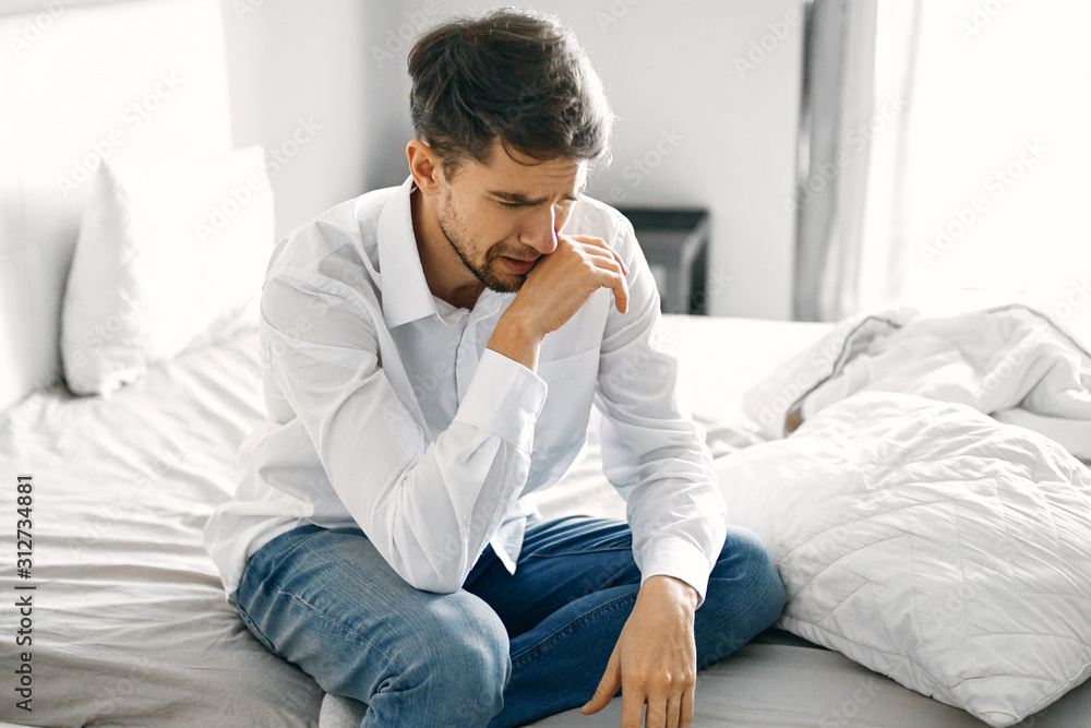 man sitting on sofa man sitting on sofa