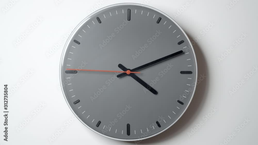 Clock Face in Timelapse from 4 to 7 o'clock on white wall Clock Face in Timelapse from 4 to 7 o'clock on white wall