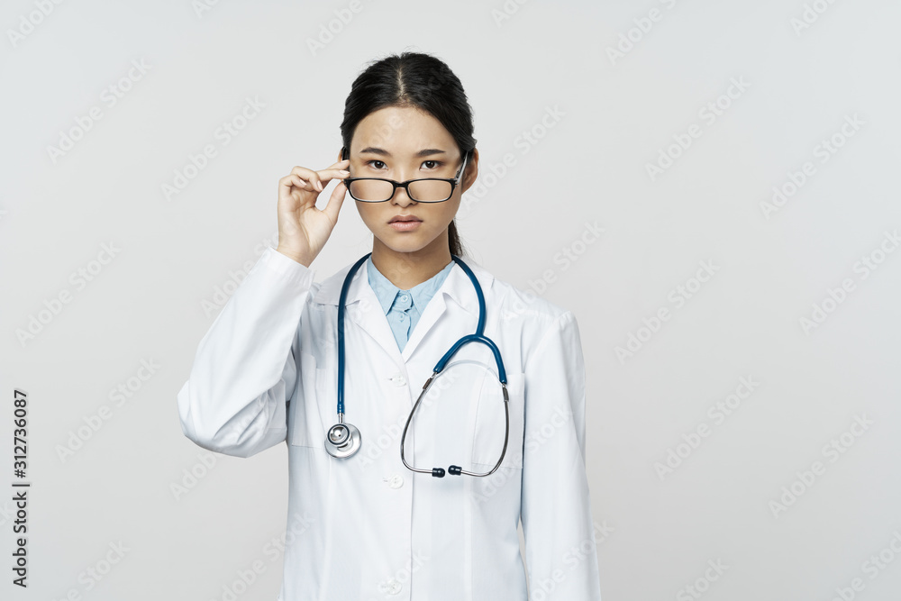 portrait of a young doctor with stethoscope portrait of a young doctor with stethoscope