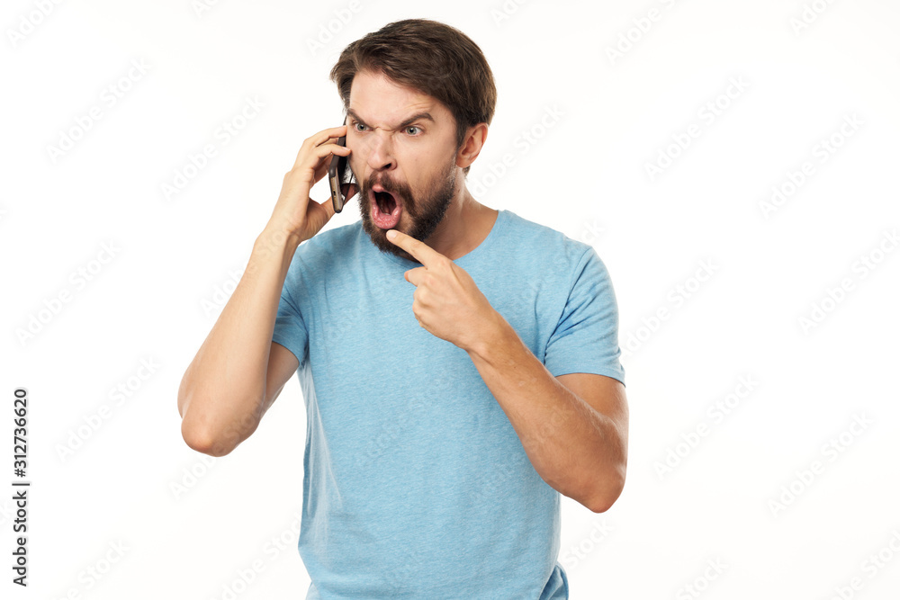 young man talking on the phone isolated on white young man talking on the phone isolated on white