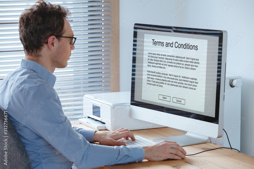 Terms of service, business man reading conditions on the screen of computer. Terms of service, business man reading conditions on the screen of computer.