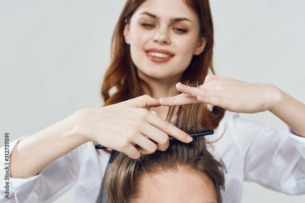 Fototapeta premium woman combing her hair