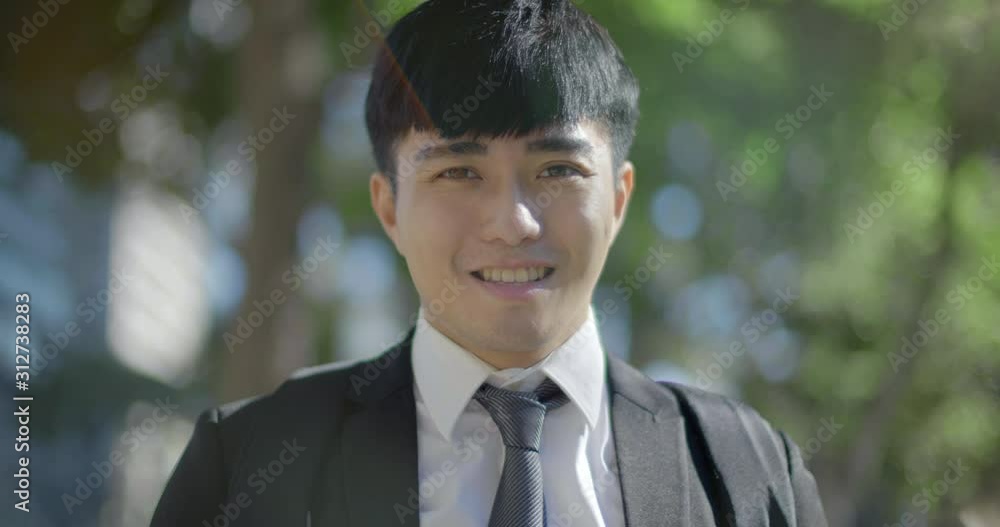 young asian handsome business man young asian handsome business man