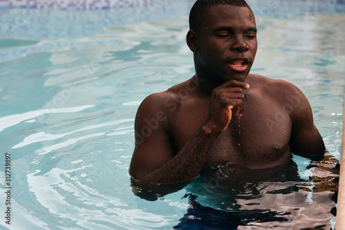 young man in swimming pool © SHOTPRIME STUDIO