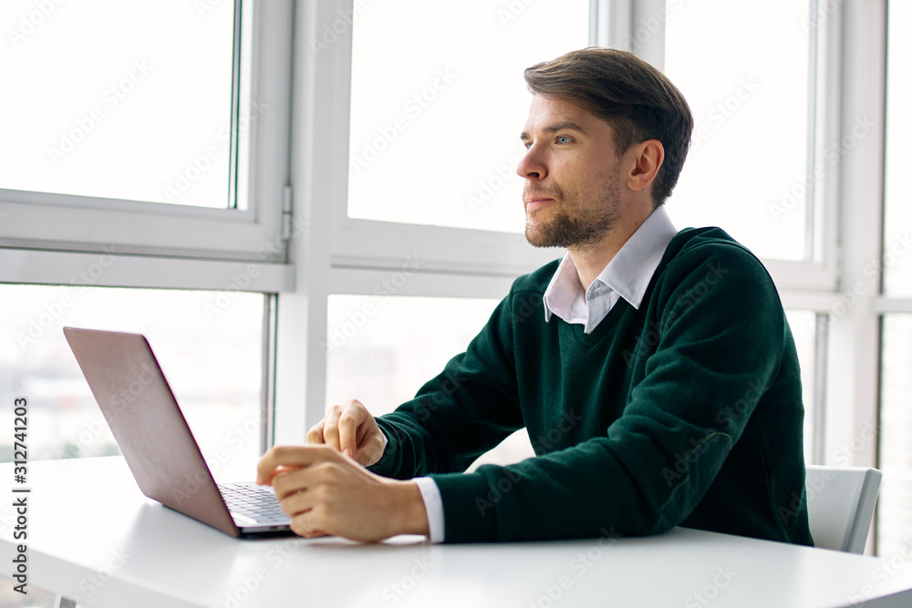 businessman working on laptop in office businessman working on laptop in office