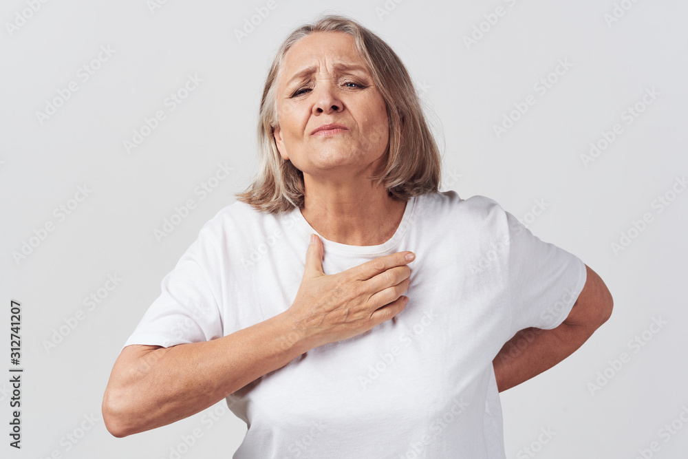portrait of senior woman with hands on hips