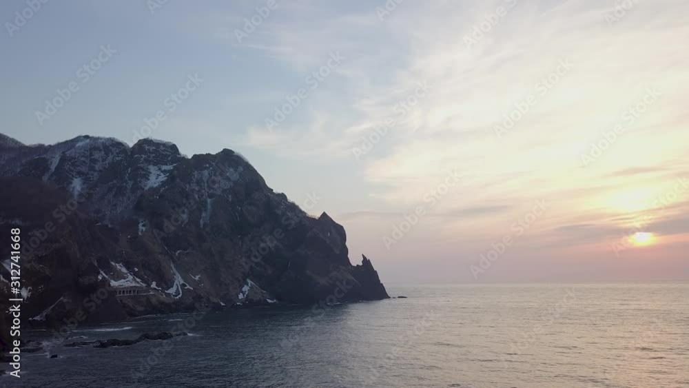 aerial shot of the sunset at the seaside. Along with the shore. aerial shot of the sunset at the seaside. Along with the shore.