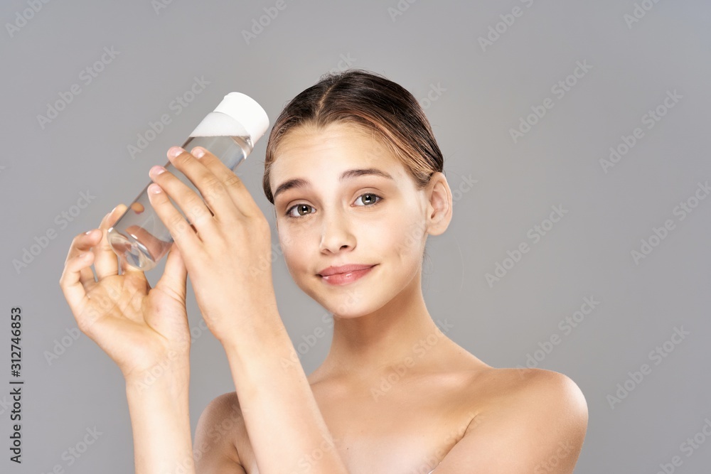 portrait of young woman with bottle of water portrait of young woman with bottle of water