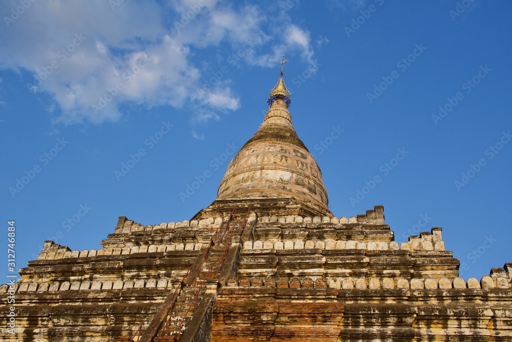 Shwesandaw Pagoda under cloudy blue sky in the sunny day, Bagan, Myanmar