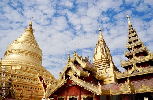 Shwezigon pagoda under cloudy blue sky, Bagan, Myanmar