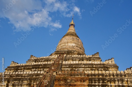 Shwesandaw Pagoda under cloudy blue sky in the sunny day  Bagan  Myanmar