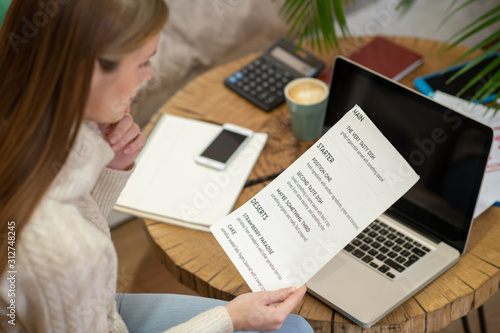 Cafe owner creating a menu for her restaurant