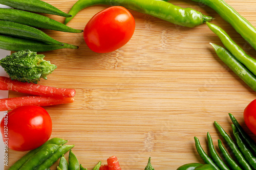 Raw vegetable on wooden board with copy space  