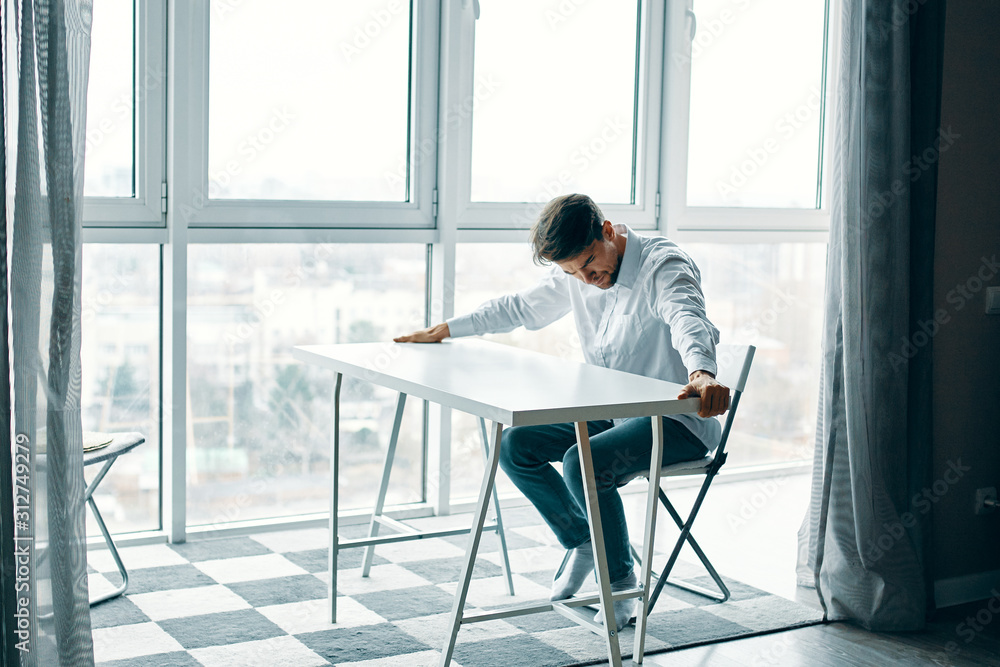 man sitting on chair and looking at camera man sitting on chair and looking at camera