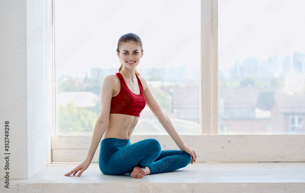 woman doing yoga on floor
