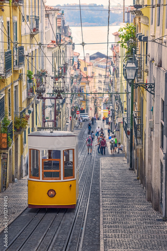 The Bica Funicular (Elevador or Ascensor da Bica) is a famous tourist attraction in Chiado District. Sunny day in summer. Travel and transport concept. Lisbon, Portugal. Europe