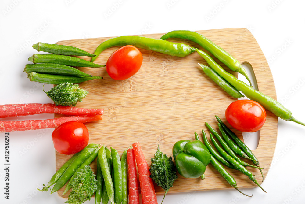 Raw vegetable on wooden board with copy space  