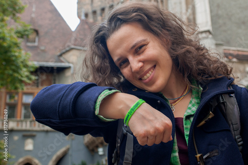 Canvas Print Young smiley woman wearing a I Love Budapest bracelet