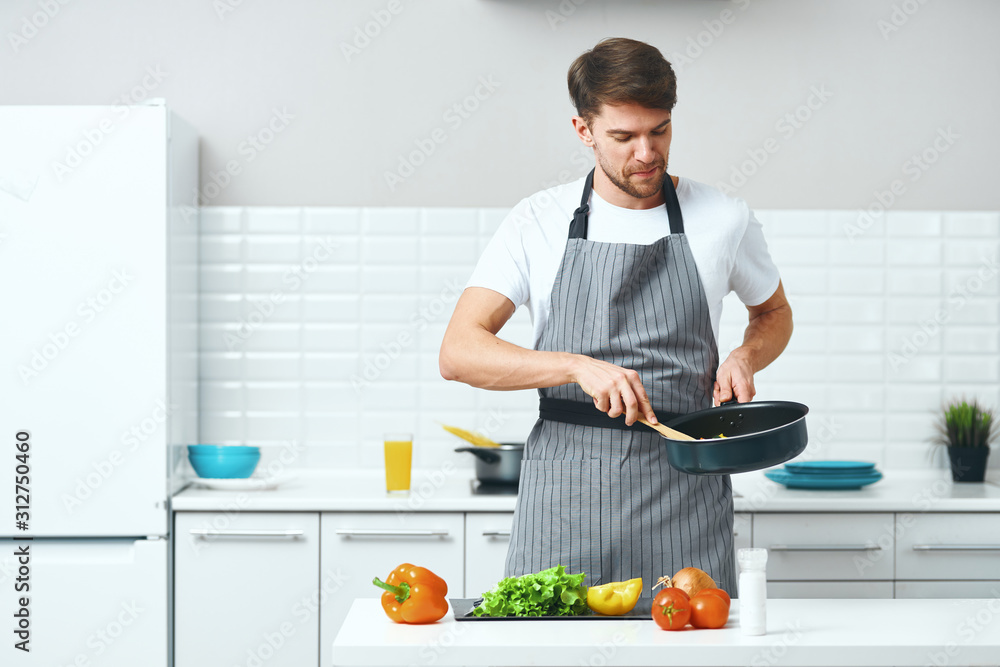 young man in kitchen young man in kitchen