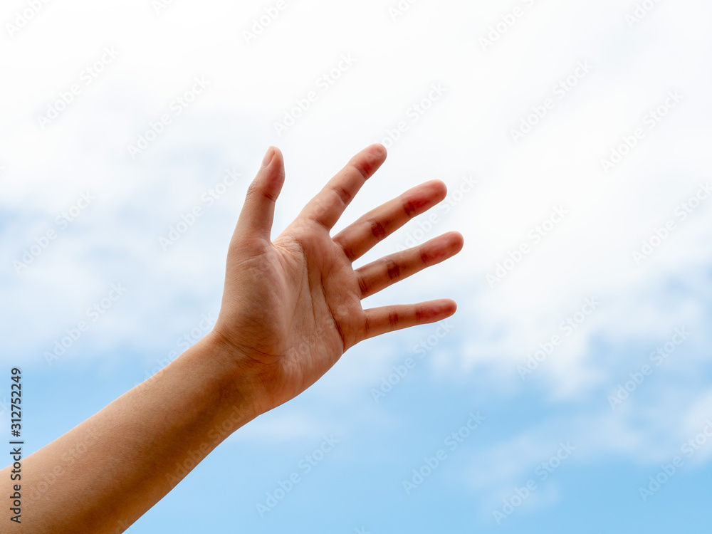 Young woman hand. Empty hand reach out or hold over blue sky. Help and hope hand concept. Young woman hand. Empty hand reach out or hold over blue sky. Help and hope hand concept.