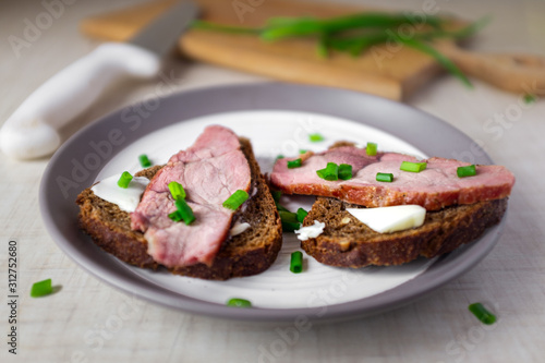 Boiled pork meat with bread and butter