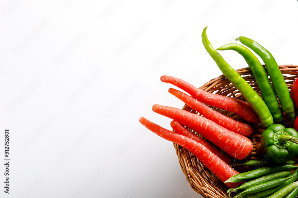Raw vegetable in wooden basket  