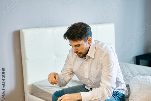 man using tablet computer at home