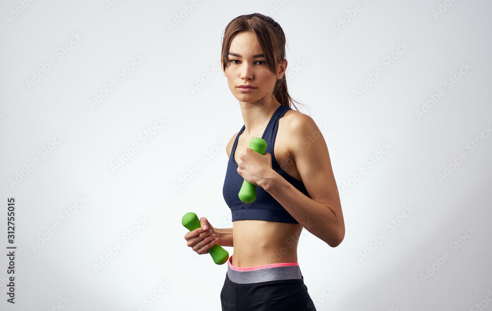 young woman with dumbbells young woman with dumbbells