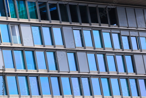 Multiple windows on a large apartment building