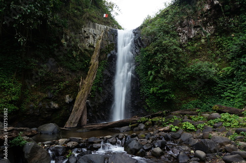 Rayap Waterfall is a beautiful place to visit with water coming from mountain sources photo