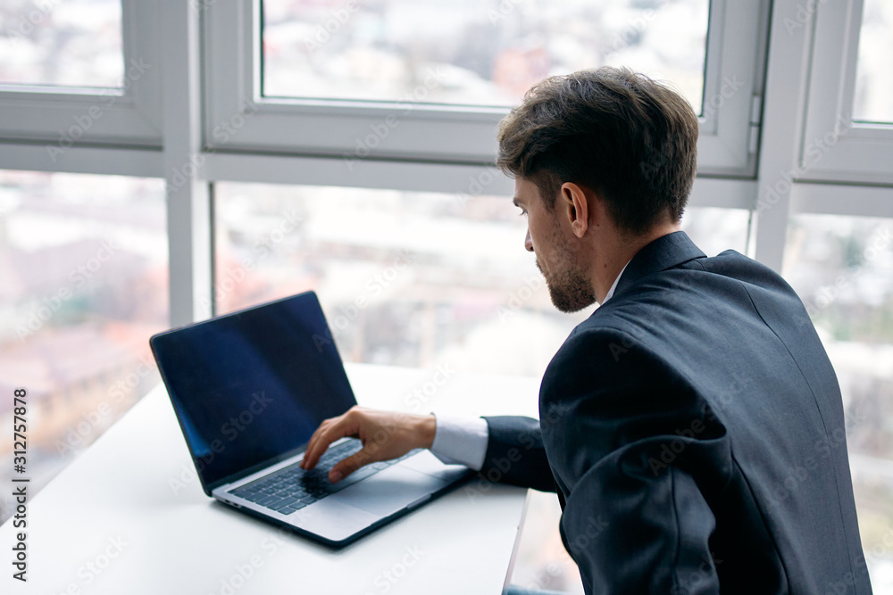 businessman working on laptop in office businessman working on laptop in office