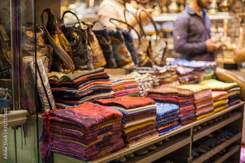 Colorful Turkish Scarf, pashminas, silk cloth textile in local market, Turkey. shops for tourists. Authentic goods for travelers. Souvenirs in Istanbul with jewelry, textile, scarfs, gift and bags