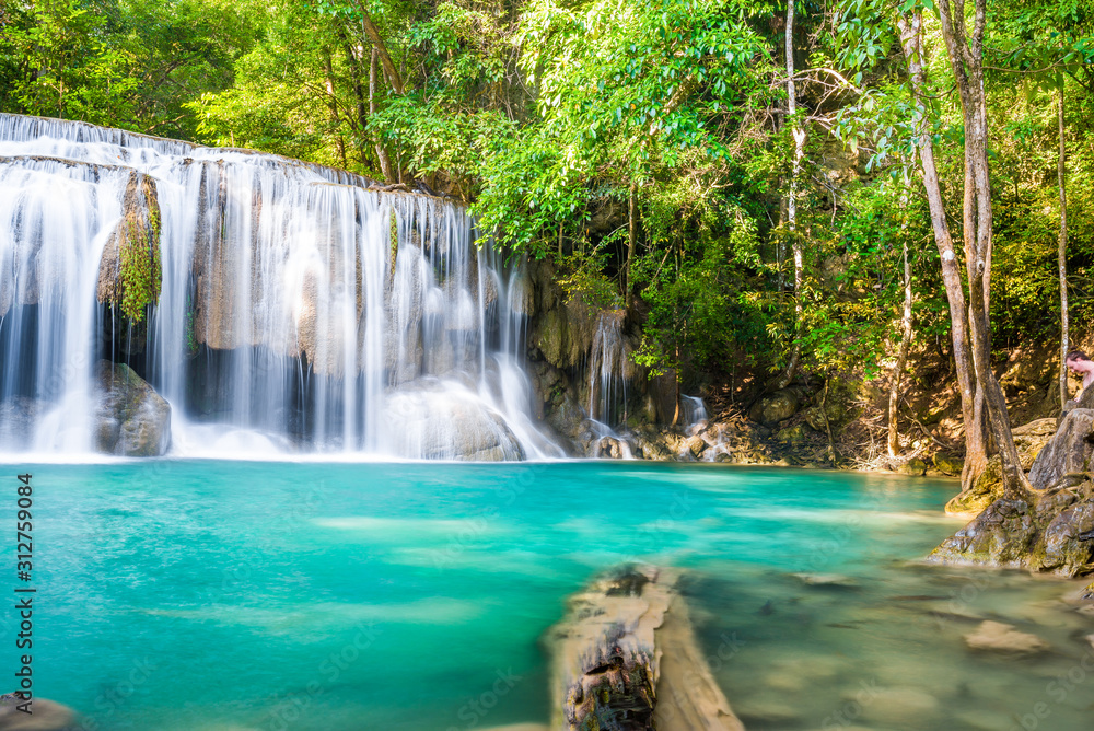 Waterfall and blue emerald water color in Erawan national park. Erawan Waterfall , Beautiful nature rock waterfall steps in tropical rainforest at Kanchanaburi province, Thailand Waterfall and blue emerald water color in Erawan national park. Erawan Waterfall , Beautiful nature rock waterfall steps in tropical rainforest at Kanchanaburi province, Thailand