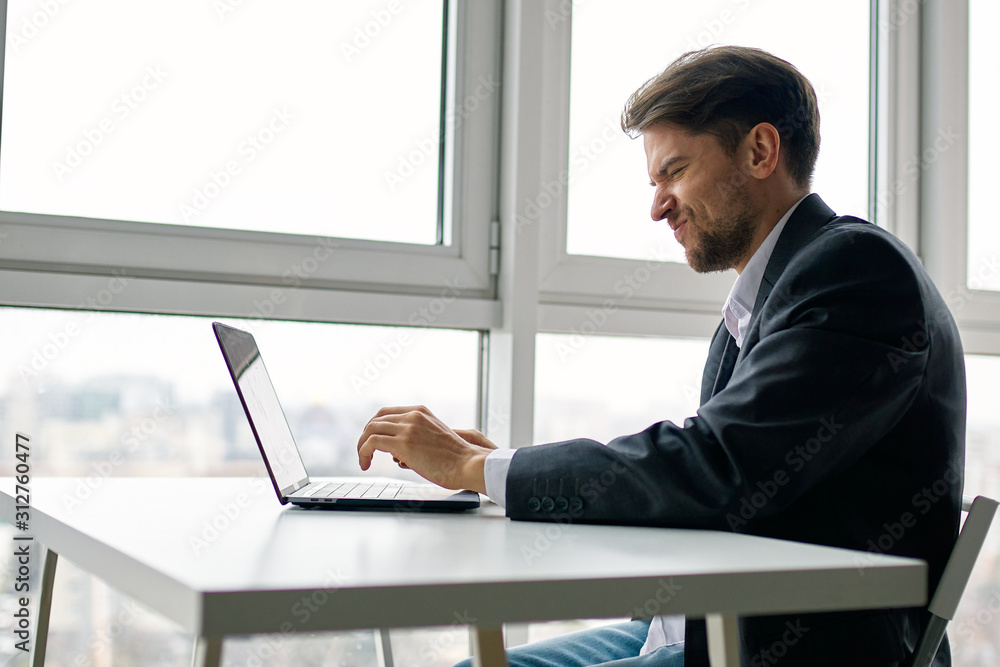 businessman working on laptop in office businessman working on laptop in office
