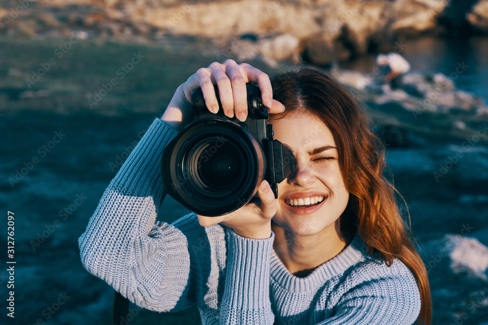woman taking photo with digital camera woman taking photo with digital camera