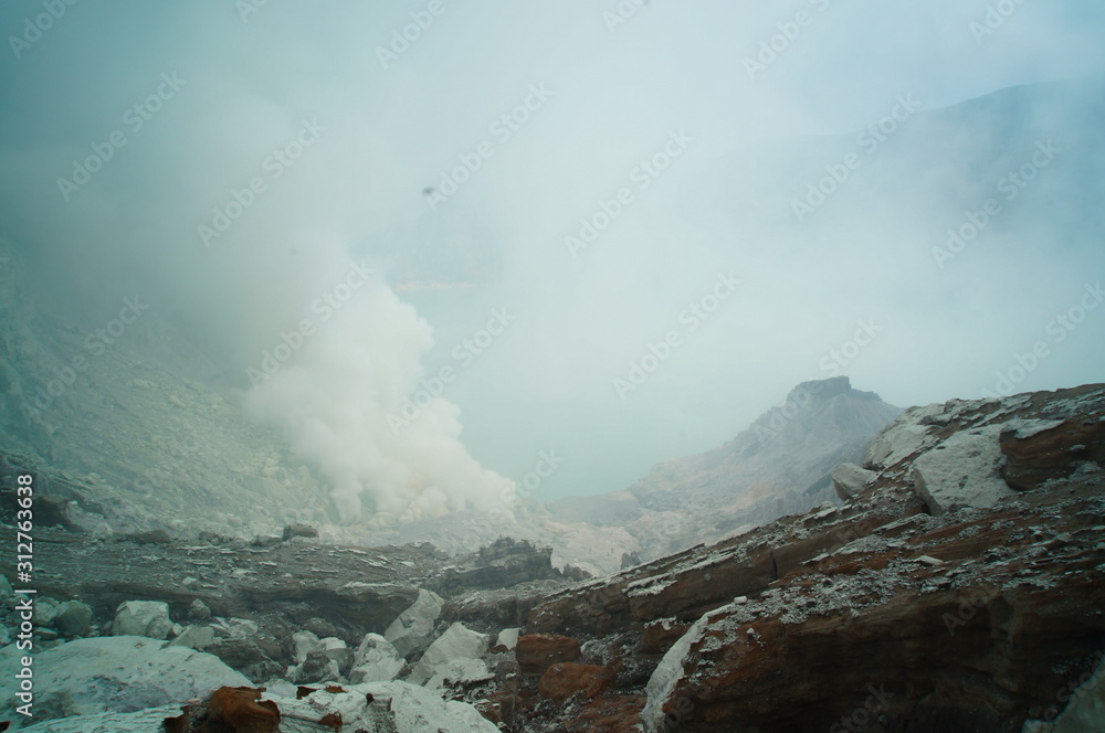 Fototapeta premium Ijen Crater is a acidic crater lake located at the top of Mount Ijen with a lake depth of 200 meters and the area of ​​the crater reaching 5,466 hectares.
