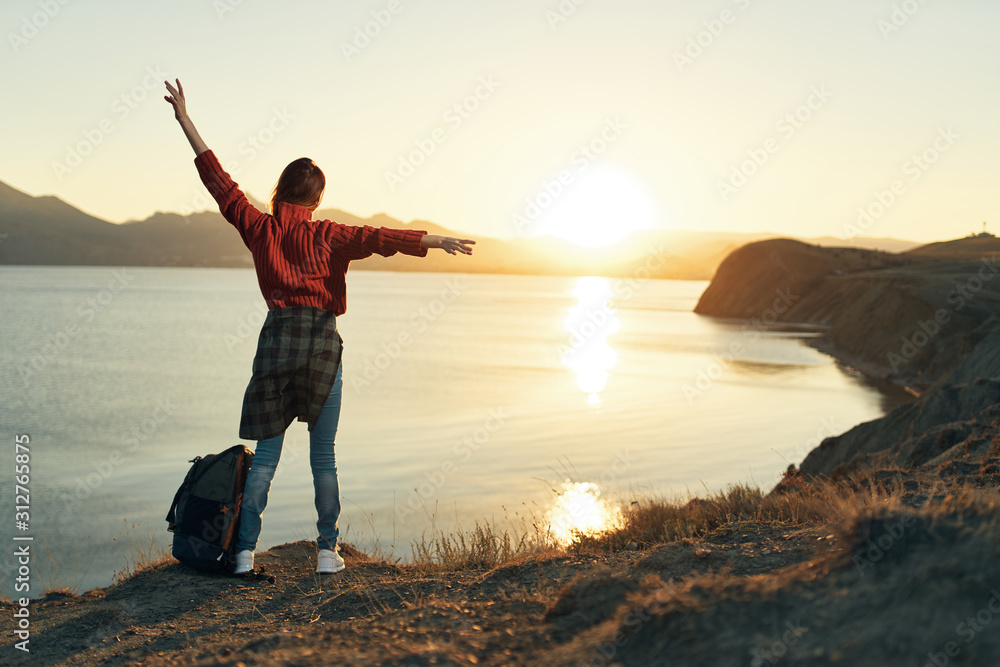 Fototapeta premium man jumping on the beach at sunset