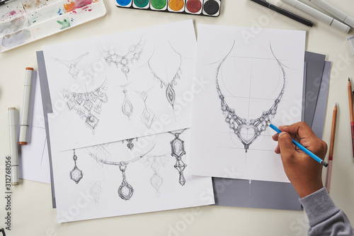 Designer design diamond jewelry drawing sketches making works craft unique handmade luxury necklaces product ideas.