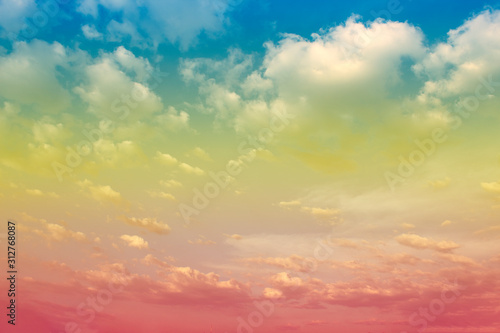 A soft fog cloug background with pastel colored orange to blue gradient photo