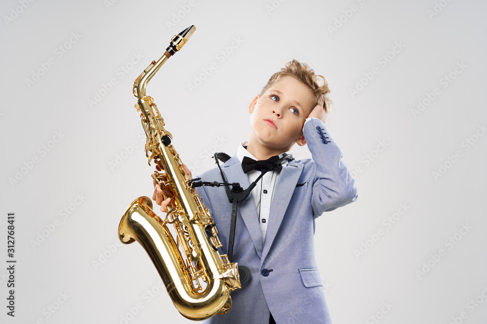Fototapeta premium boy with saxophone