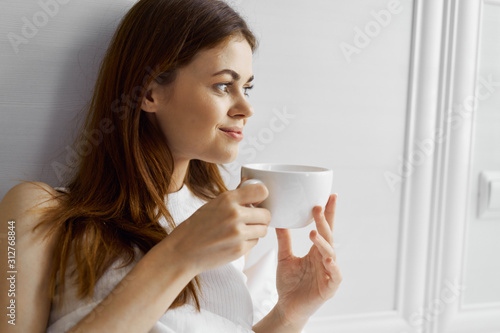 young woman with cup of coffee