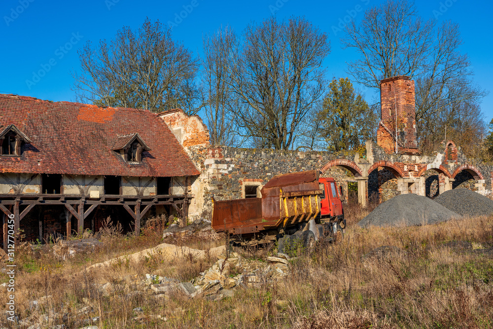 Old lorry on a construction site..Palace Ruin in Wlosien, Poland. Old lorry on a construction site..Palace Ruin in Wlosien, Poland.