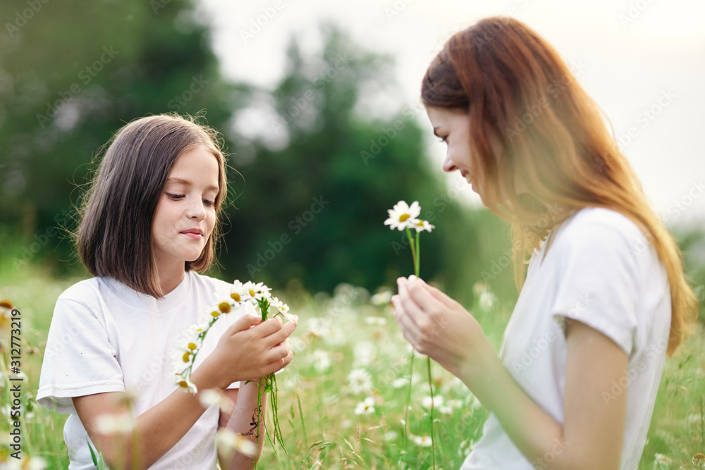 mother and daughter with flowers mother and daughter with flowers