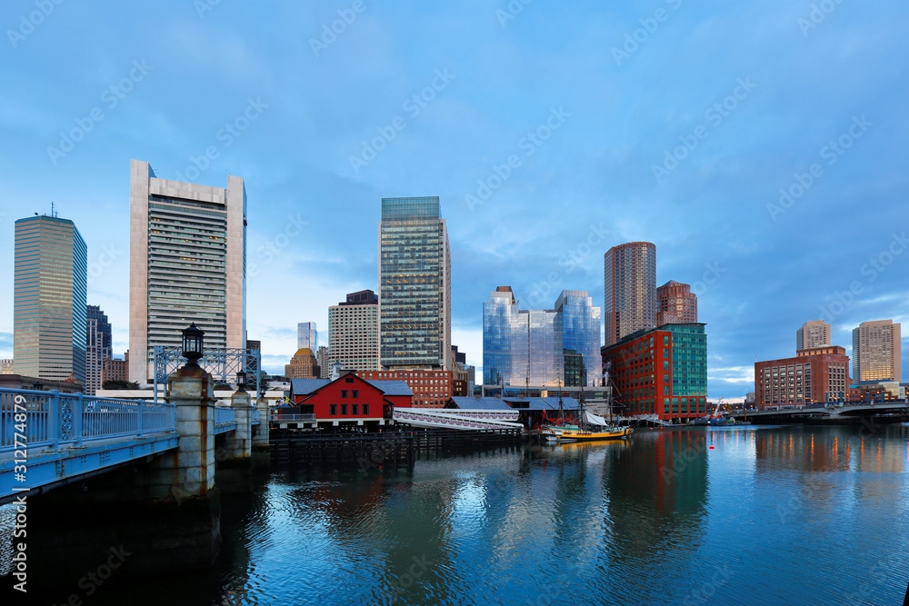Boston Harbor at sunrise viewing from Fan Pier Park. Boston Harbor is a natural harbor and estuary of Massachusetts Bay,
