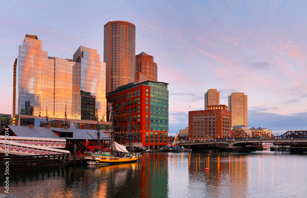 Obraz premium Boston Harbor at sunrise viewing from Fan Pier Park. Boston Harbor is a natural harbor and estuary of Massachusetts Bay,