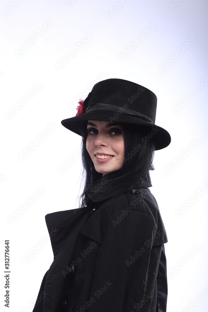 portrait of a young brunette in a black hat portrait of a young brunette in a black hat